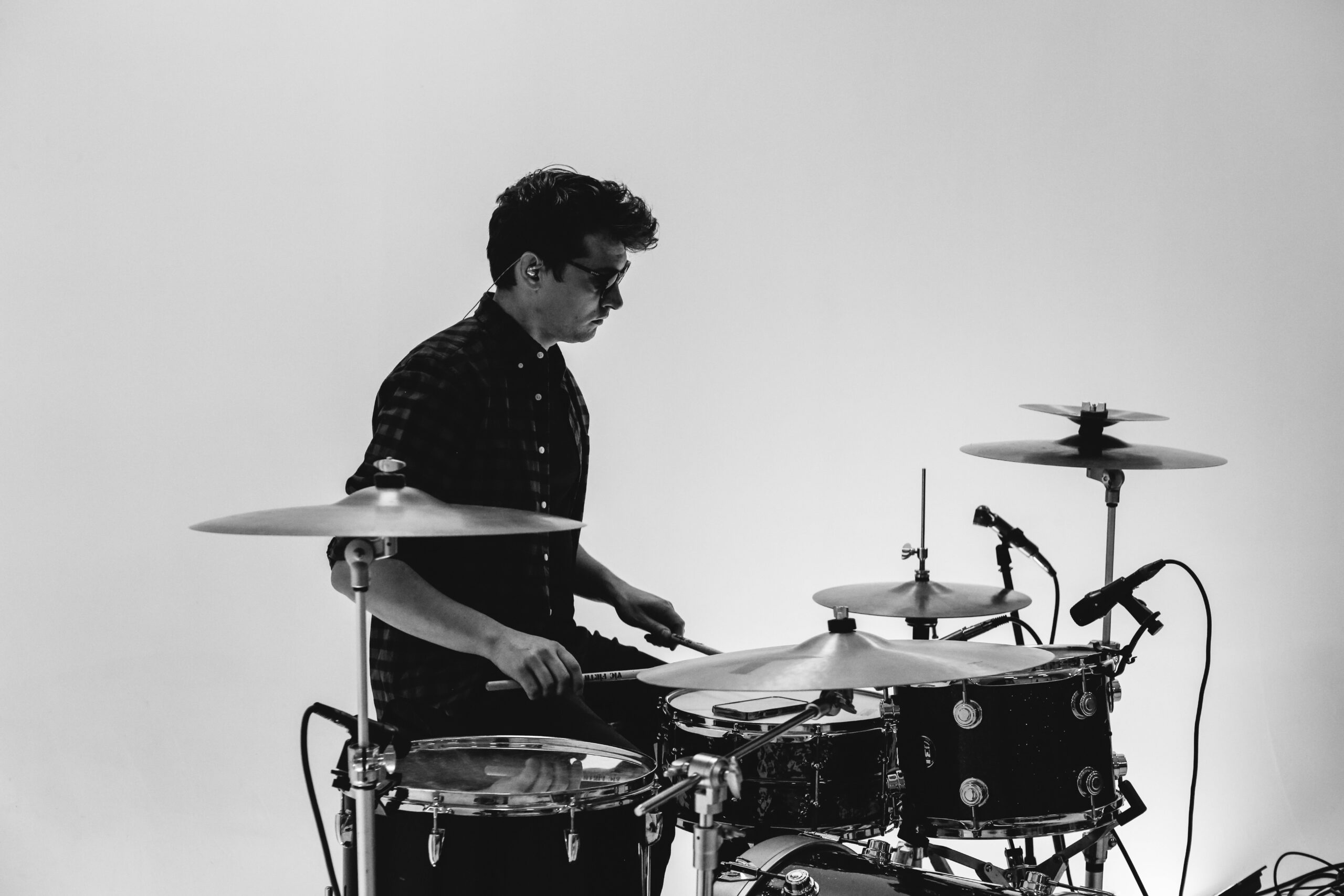 Joe Della Penna driving the beat at a Little Moses Jones high-energy wedding entertainment performance — live event drummer
