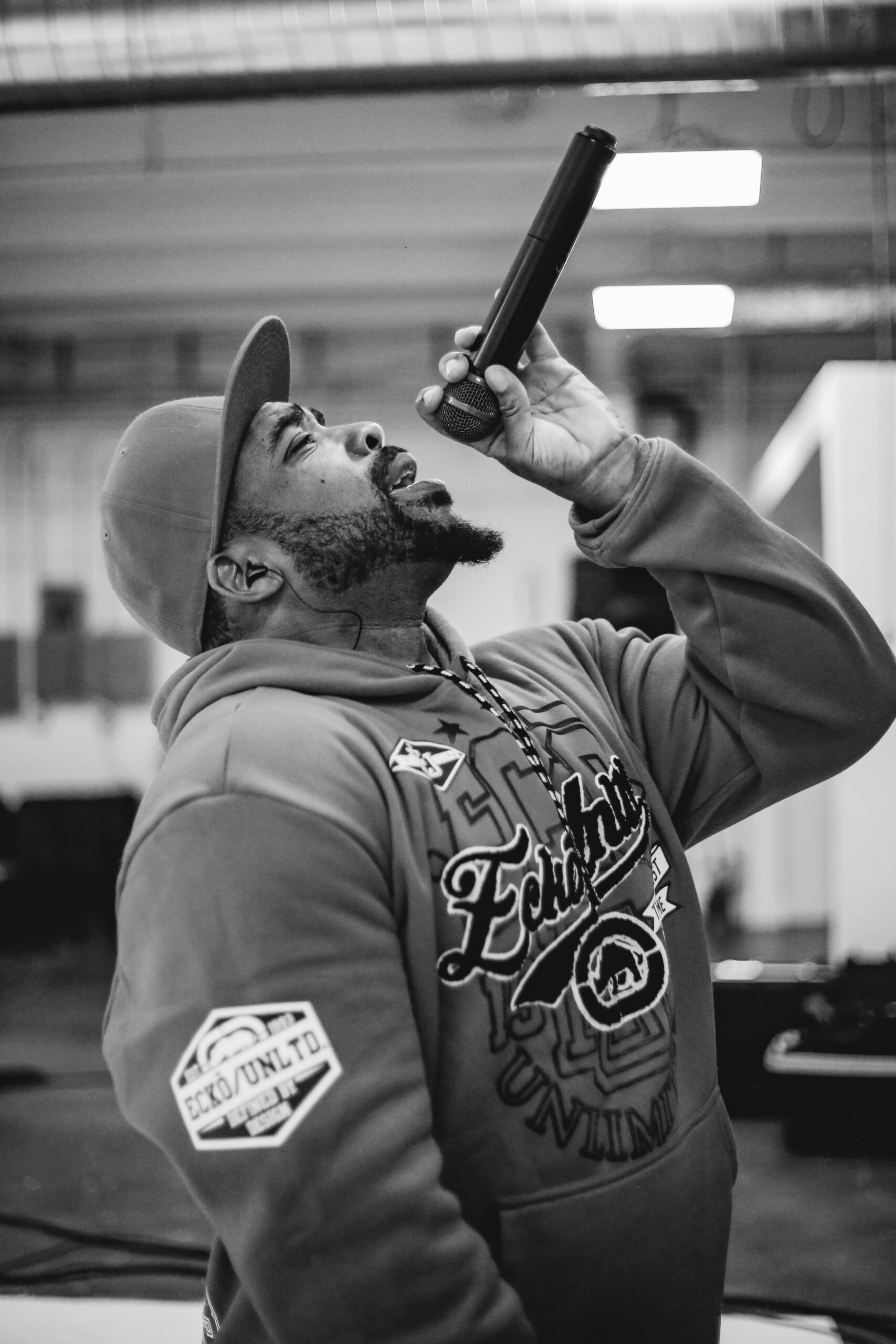 Bad Juju delivering high-energy vocals at a Little Moses Jones live special event — 90s and 2000s R&B and Hip-Hop entertainment